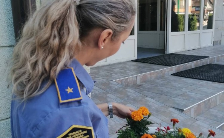 Policewomen planted orange flowers as a sign of solidarity with women and girls victims of violence